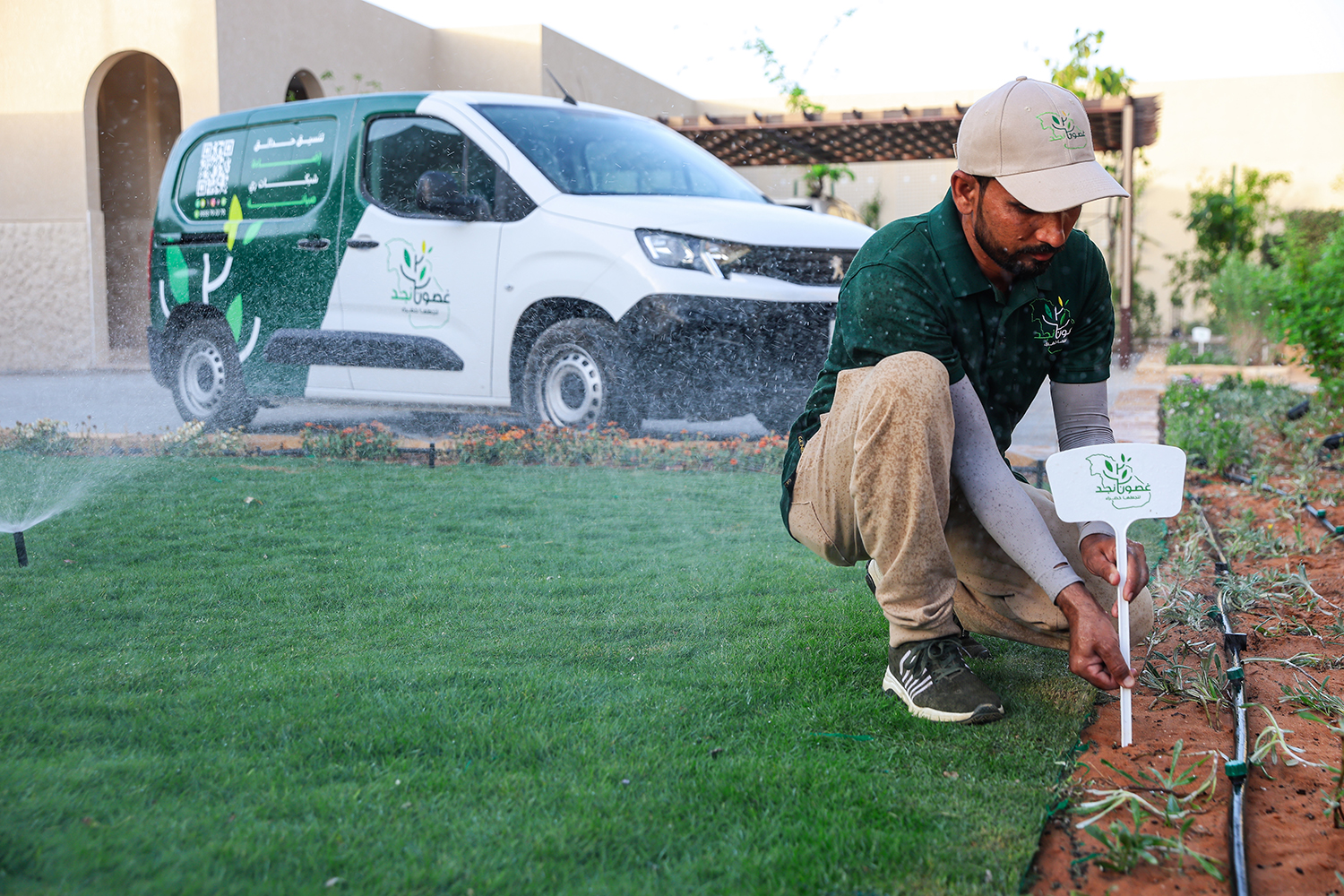 Technician installing irrigation